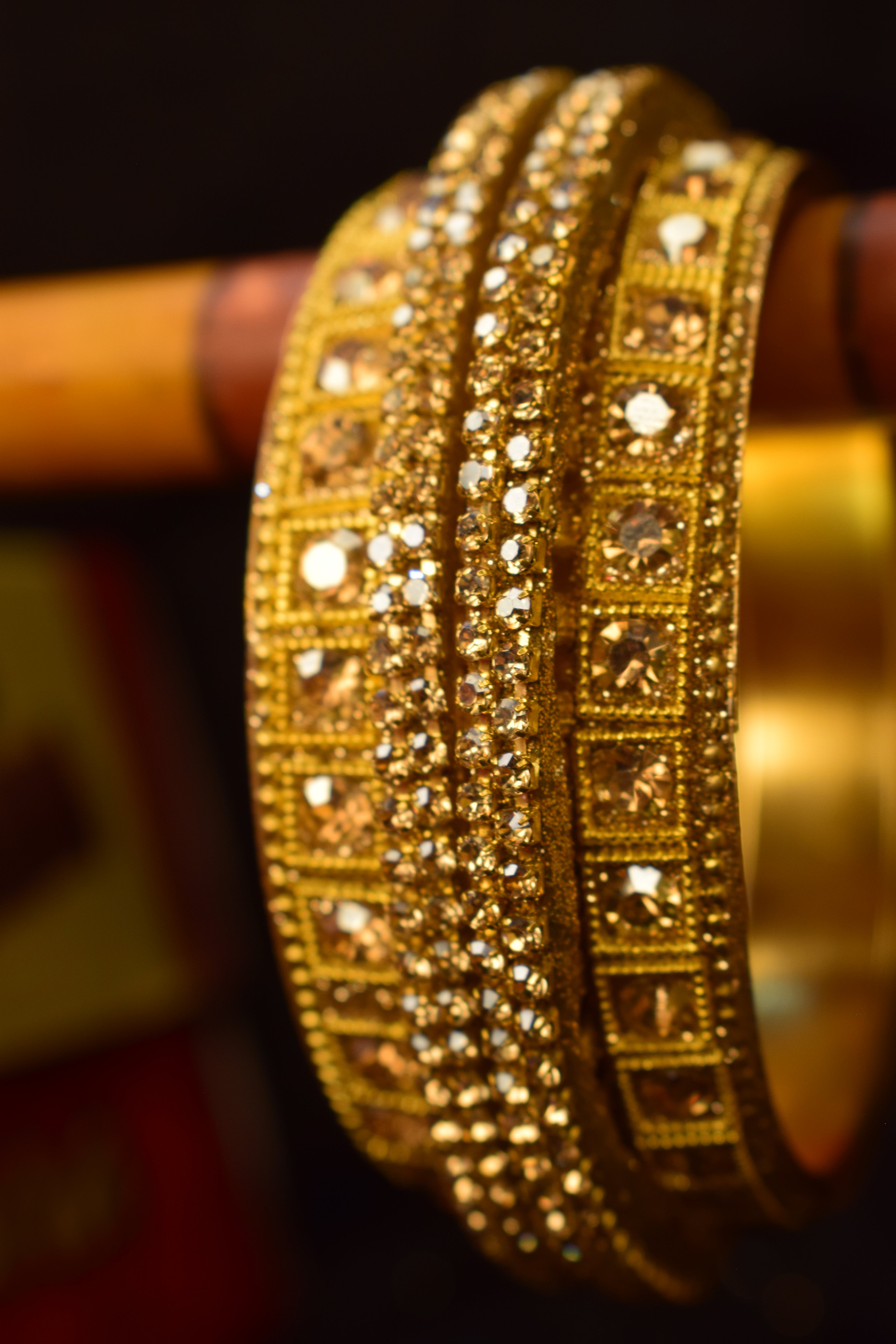 Luxurious Gold-Toned Statement Bangles with Amber Crystals