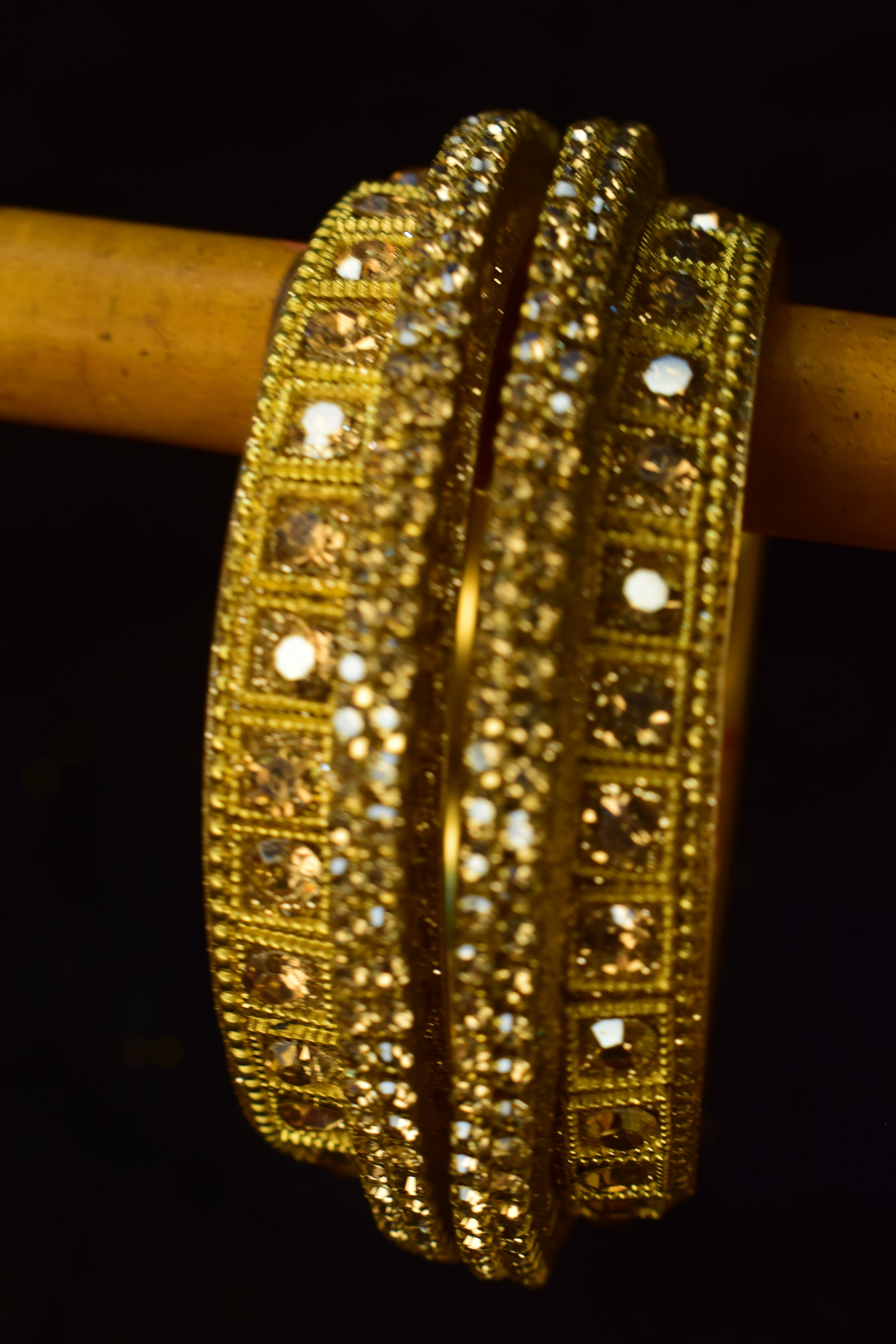 Luxurious Gold-Toned Statement Bangles with Amber Crystals
